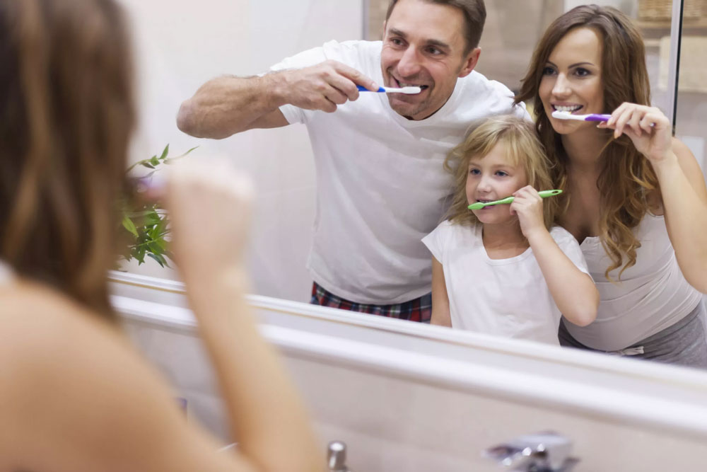 Family is brushing teeth