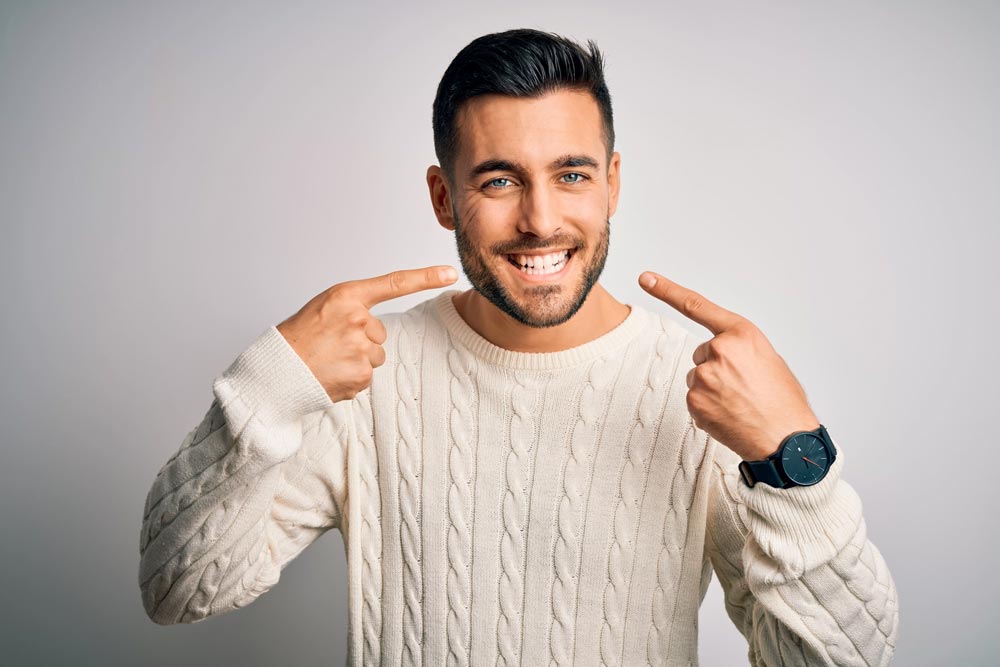 Man smiling showing his teeth