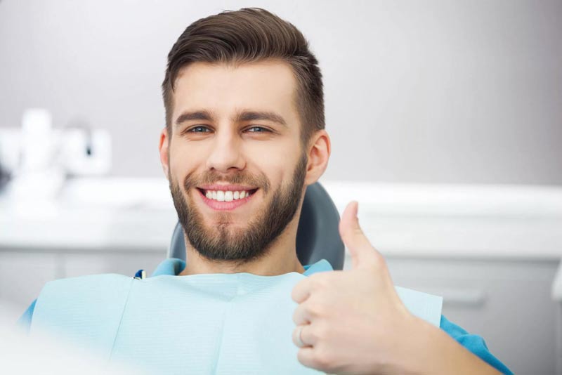Thumbs up with a smiley of a man
