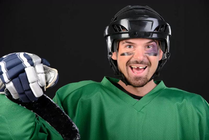 Rugby player with broken tooth